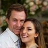 Smiling couple at a wedding reception